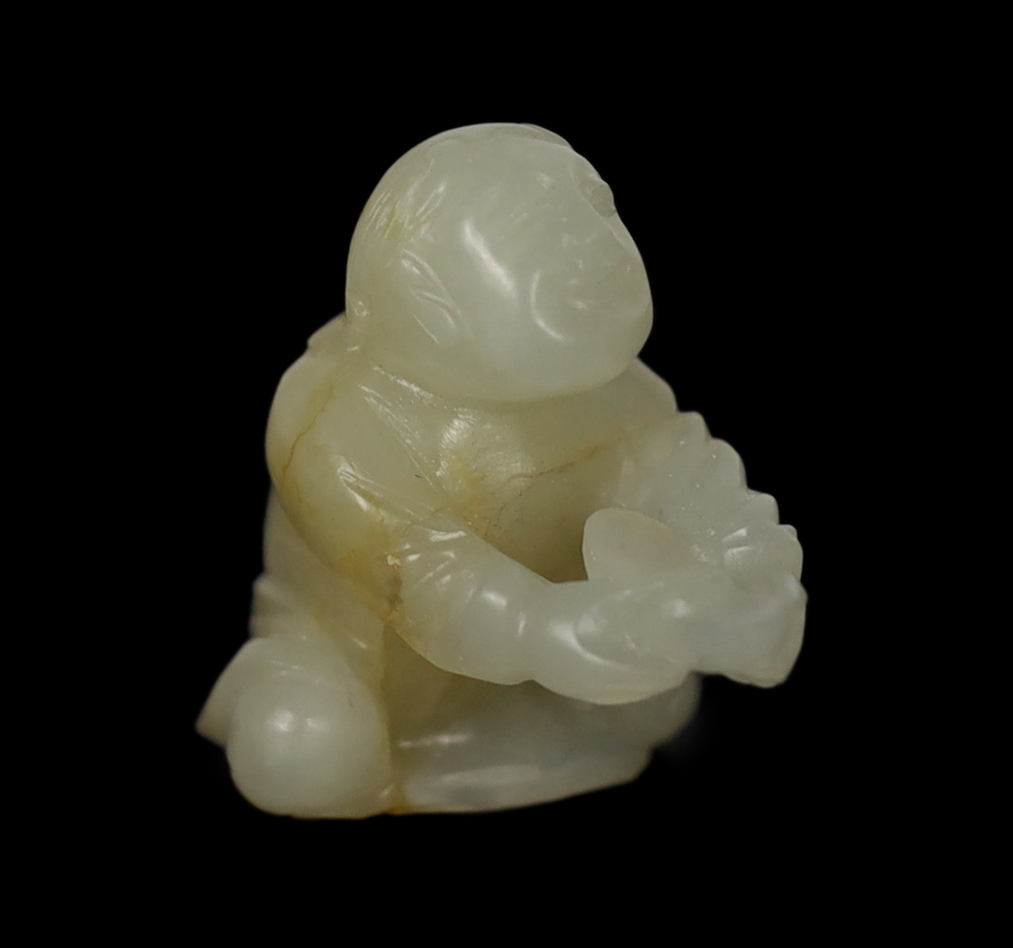 A Chinese white and russet carved jade figure of Liu Hai, 17th century